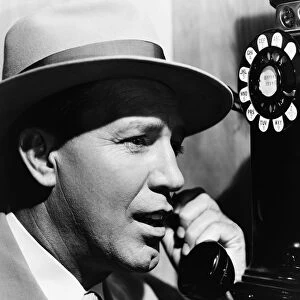 Man Speaking on Pay Telephone in 1950S