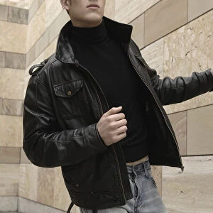 Man wearing a leather jacket, running
