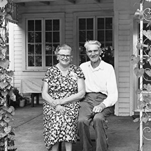 Man and woman sitting on porch