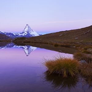 Matterhorn reflected in lake Stellisee, at dusk, Valais Alps, Canton of Valais, Zermatt, Switzerland
