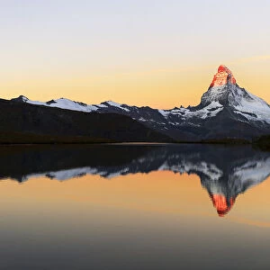 Matterhorn reflected in lake Stellisee, at sunrise, Valais Alps, Canton of Valais, Zermatt, Switzerland