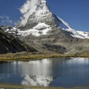 Matterhorn reflected in Riffelsee, Zermatt, Valais Canton, Switzerland Matterhorn reflected in Riffelsee, Zermatt, Valais Canton, Switzerland