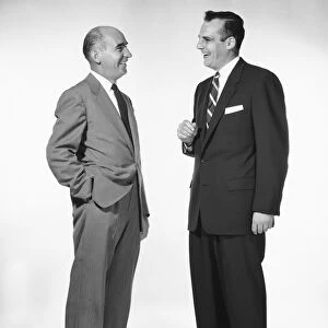 Two men talking and laughing