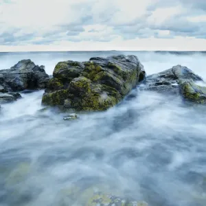 Mist over rocks and sea Mist over rocks and sea