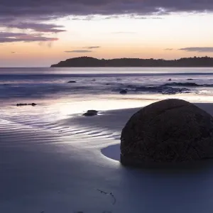 Moeraki Boulders on the beach at sunrise, Moeraki Beach, Hampden, Otago Region, New Zealand Moeraki Boulders on the beach at sunrise, Moeraki Beach, Hampden, Otago Region, New Zealand