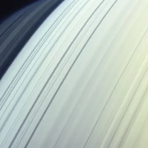 Moon (Mimas) orbiting Saturns northern latitudes, satellite view Moon (Mimas) orbiting Saturns northern latitudes, satellite view