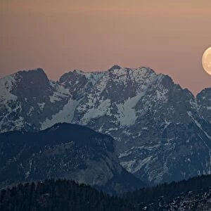 The full moon rising over the Kaiser Mountains, Tyrol, Austria