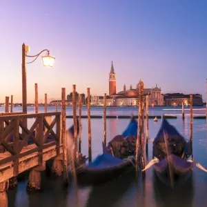 Moored gondolas in St Marks basin at sunrise. Venice, Veneto, Italy Moored gondolas in St Marks basin at sunrise. Venice, Veneto, Italy