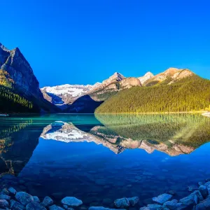 Mountain reflection print on Lake Louise at sunrise Mountain reflection print on Lake Louise at sunrise