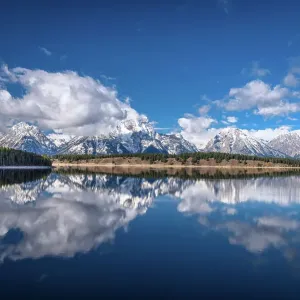 Mountains and clouds reflecting on Jackson Lake, Grand Teton National Park, Wyoming Mountains and clouds reflecting on Jackson Lake, Grand Teton National Park, Wyoming