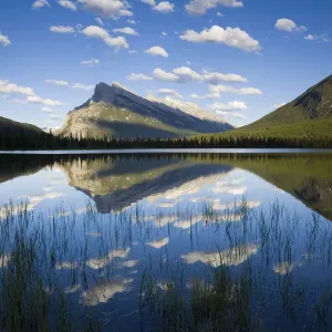 Mountains and clouds reflecting in lake Mountains and clouds reflecting in lake