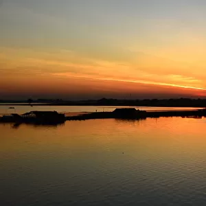 Myanmar sunset on Taugthaman lake