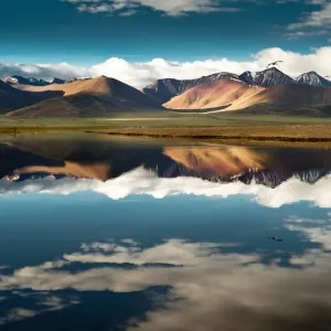 Namtso lake with reflection of mountains and bird Namtso lake with reflection of mountains and bird