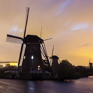 Netherlands, South Holland, Kinderdijk, Silhouette of traditional windmills