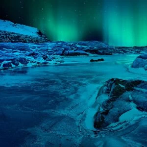 Northern light over frozen Skaftafell glacier lake