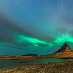 Northern light at Kirkjufell with startrail and grass foreground