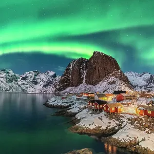 Northern lights above Festhelltinden peak and Hamnoy, Lofoten Islands Northern lights above Festhelltinden peak and Hamnoy, Lofoten Islands