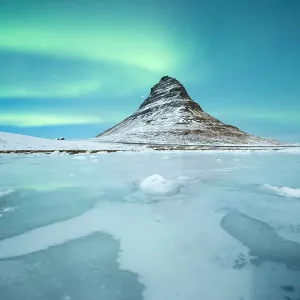 Northern lights over Mount Kirkjufell Northern lights over Mount Kirkjufell