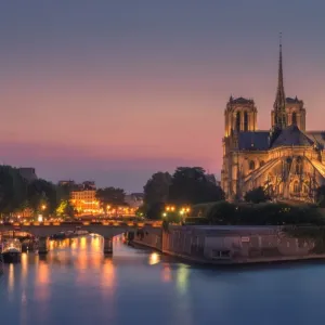 Notre dame at night with city light Notre dame at night with city light