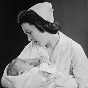 Nurse holding crying baby (B&W)