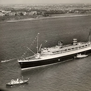 Ocean liner with tug boats