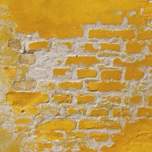 Ochre yellow brick wall