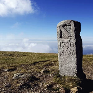 Old boundary stone on the summit of Mt. Belchen in the Black Forest, Baden-Wuerttemberg, Germany, Europe