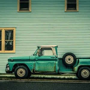 Old Truck Print against Wooden Building