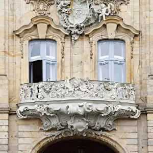 An Old House With An Ornate Balcony