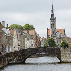 Old stone bridge across the canal in Bruges, West Flanders, Belgium