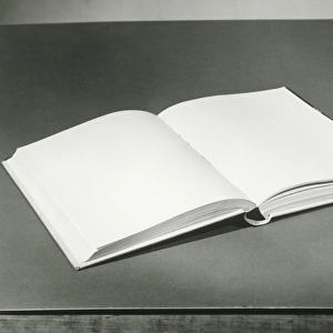 Open blank book on table