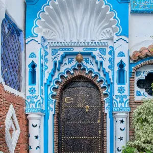 An ornate blue and white doorway in the Blue City of Chefchaouen An ornate blue and white doorway in the Blue City of Chefchaouen