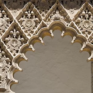 Ornate decorated arch of the Seville Alcazar in Spain