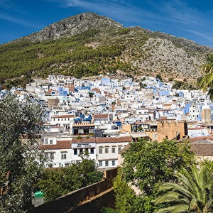 Panoramic aerial view of Chefchaouen city skyline in front of the Rif mountains, Morocco