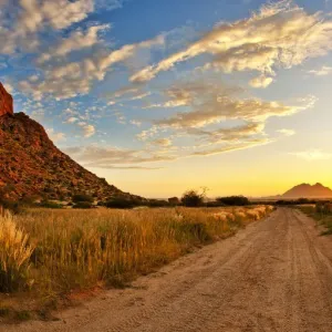 A Panoramic Sunset Landscape Photo of Spitzkoppe in Namibia, Erongo, Namibia A Panoramic Sunset Landscape Photo of Spitzkoppe in Namibia, Erongo, Namibia