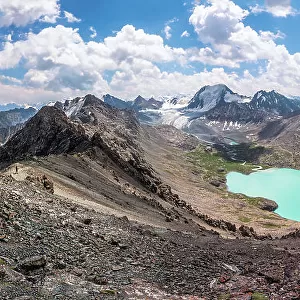 The panoramic view of Ala-Kul lake on high altitude Tien Shan mountains, near Karakol, Kyrgyzstan