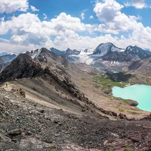 The panoramic view of Ala-Kul lake on high altitude Tien Shan mountains, near Karakol, Kyrgyzstan