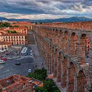 Panoramic view of Aqueduct of Segovia illuminated by the setting sun, Spain