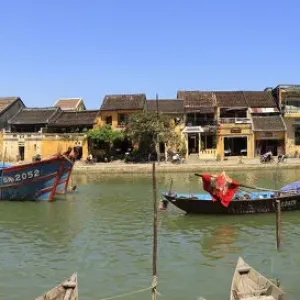 panoramic view of old town and river with boats panoramic view of old town and river with boats