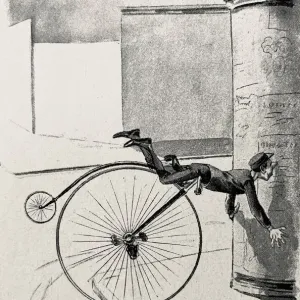 Un cycliste de bicyclette penny farthing tombe sur un pilier publicitaire. Un cycliste de bicyclette penny farthing tombe sur un pilier publicitaire.