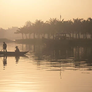 People on the boat in early morning in Hoian, Vietnam