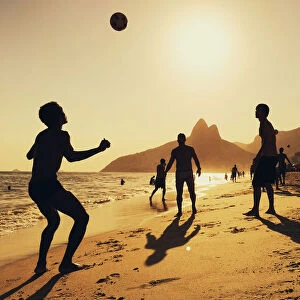 People playing football at Ipanema Beach in Rio