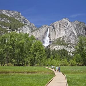 People Walking on Boardwalk Near Yosemite Waterfall