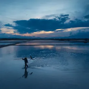 People walking in salt field People walking in salt field