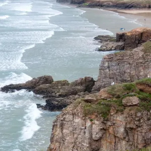Perranporth Beach Print: Cliffside View of Surfers Perranporth Beach Print: Cliffside View of Surfers