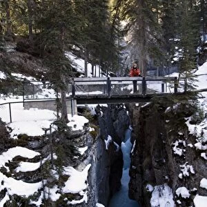 Person standing on a bridge, Maligne Canyon, Jasper National Park, Alberta, Canada