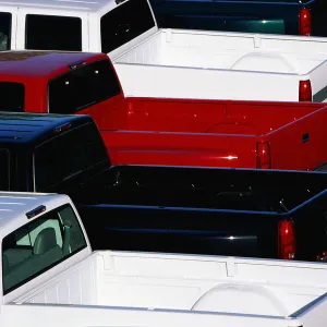 Pickup trucks parked in lot