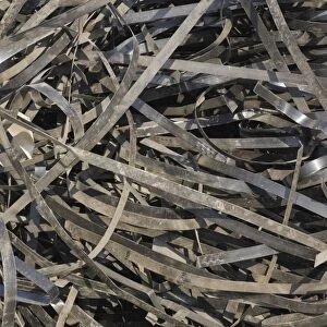 Pile of discarded metal straps at a scrap metal recycling centre, Quebec, Canada
