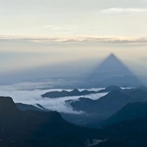 Pilgrim mountain, sun creating a triangle shadow in the landscape, image of God, Buddhist temple, Adams Peak, Sri Pada, Dalhousie, Zentrales Hochland, Sri Lanka