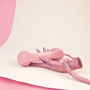 Pink phone and mannequin hand